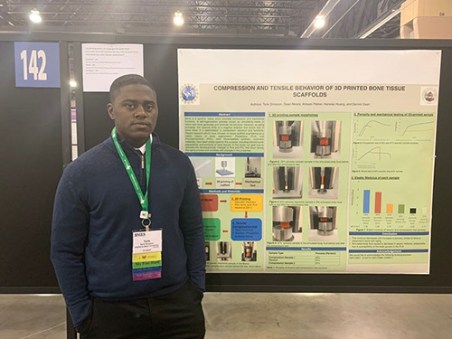  Tarik Simpson  presents a poster about his research during the BMES (Biomedical Engineering Society annual meeting in Philadelphia in 2019. (Image courtesy of Tarik Simpson.)